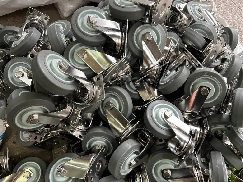 Multiple gray casters with 4 inch stainless steel brackets